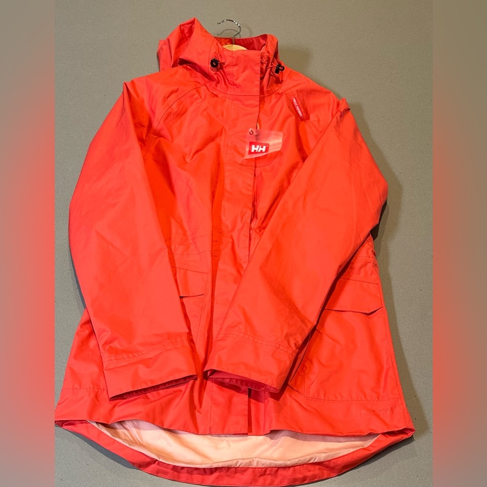 New with tags: Helly Hansen raincoat, size medium. Never worn, perfect condition